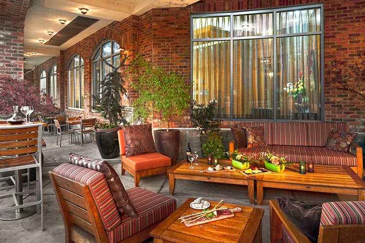 Warm weather dining and handcrafted drinks are tradition at the Front Porch at Trellis